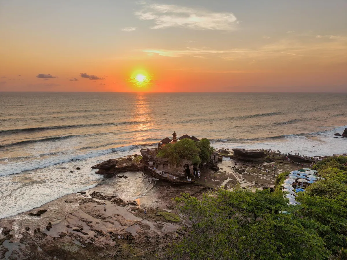 Breathtaking view of sunset over Tanah Lot Temple in Bali, Indonesia.