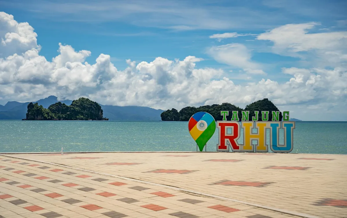 Breathtaking view of Tanjung Rhu beach in Langkawi, Malaysia with blue skies and sea.