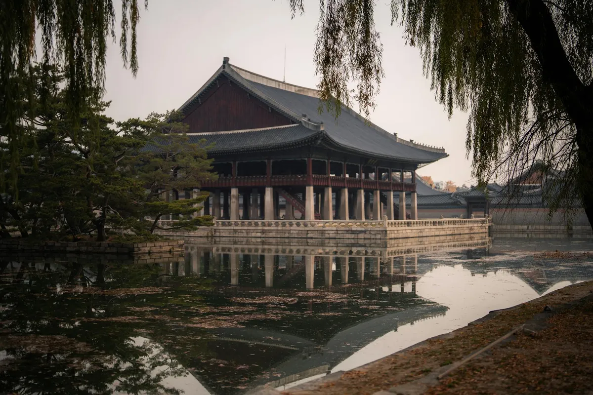 Gyeonghoeru Pavilion reflecting in the pond at Gyeongbokgung Palace, Seoul during autumn.