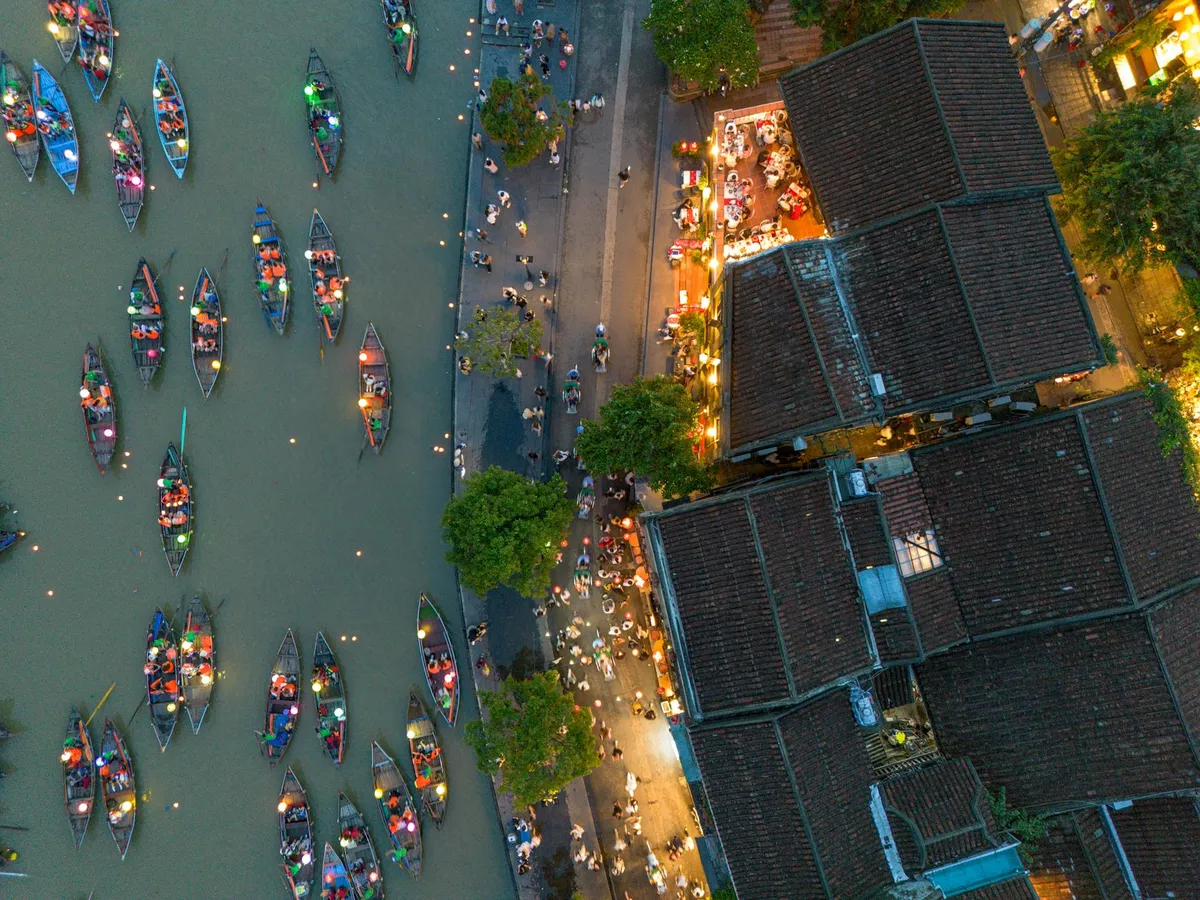 Stunning aerial photo of Hội An's lantern-lit river and streets, capturing the vibrant evening scenes.