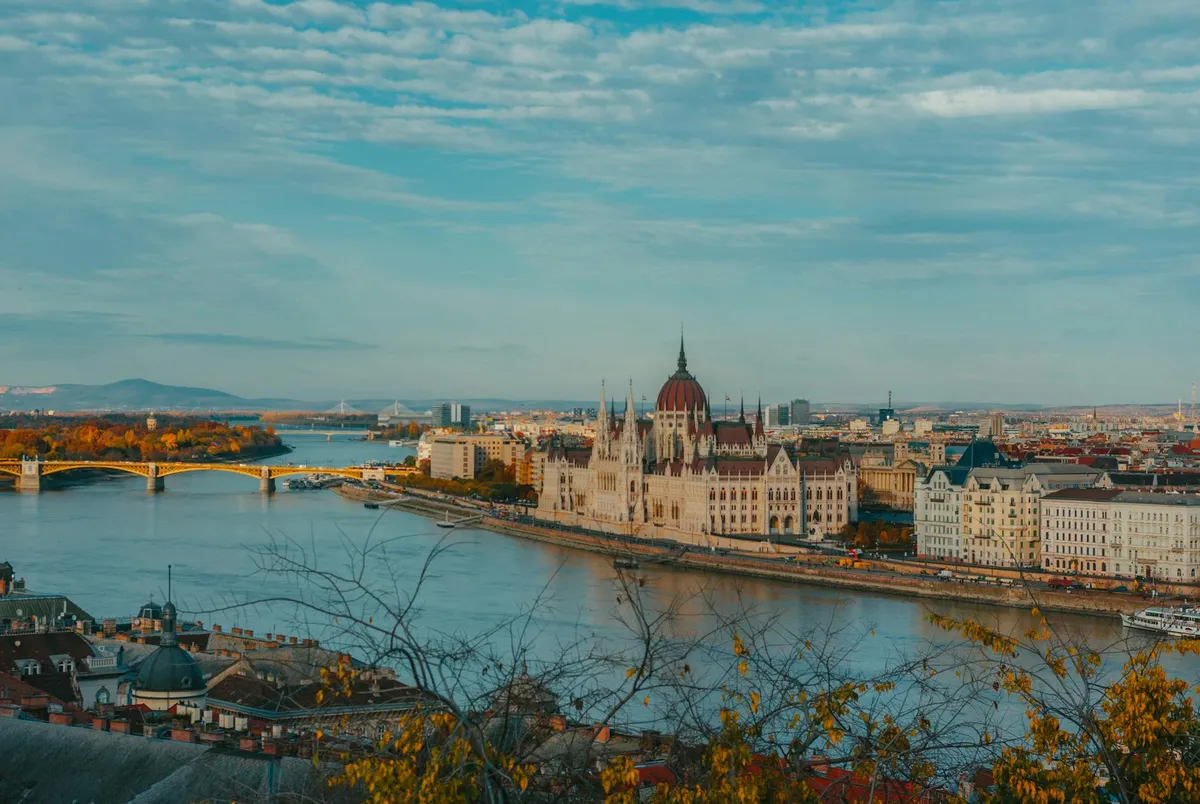 A breathtaking aerial view of Budapest featuring the iconic Parliament along the Danube River.