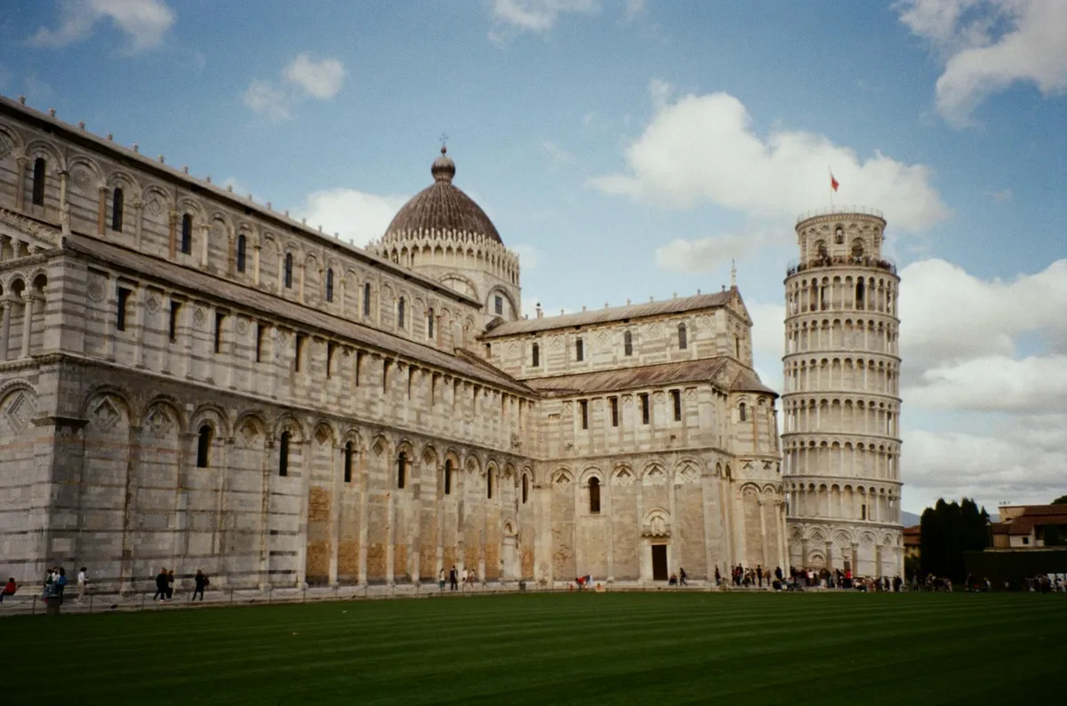 View of the Leaning Tower of Pisa and Pisa Cathedral in Italy's Piazza dei Miracoli.