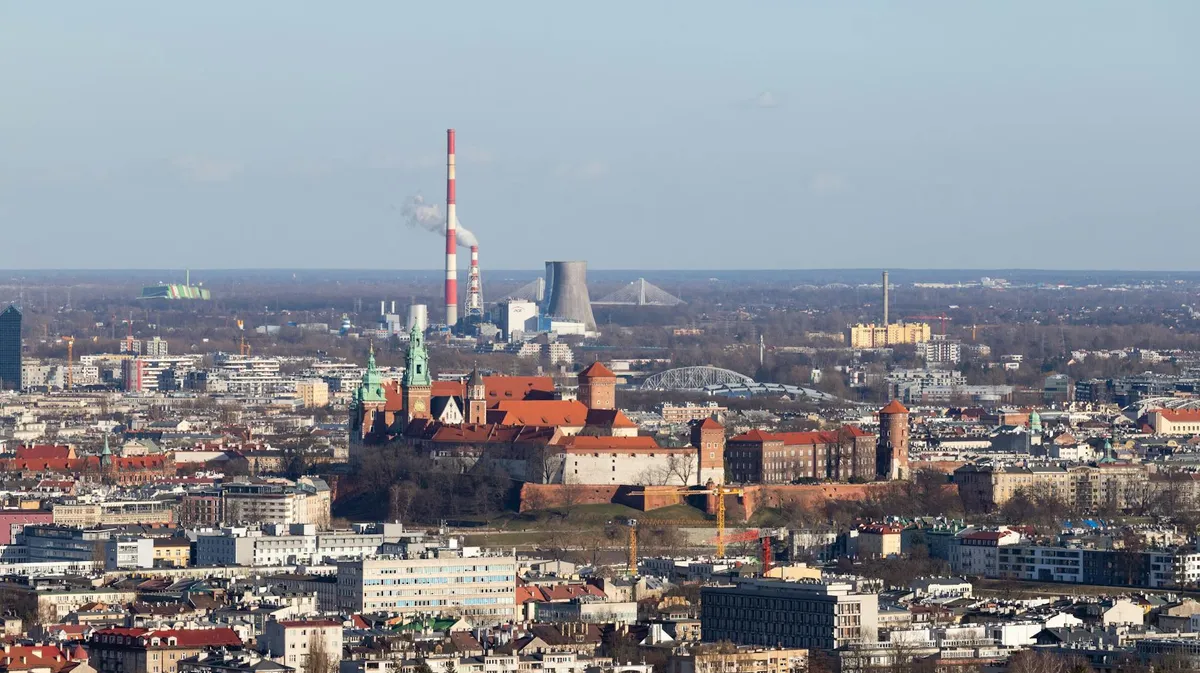 Aerial view of Krakow featuring the historic Wawel Castle and cityscape.