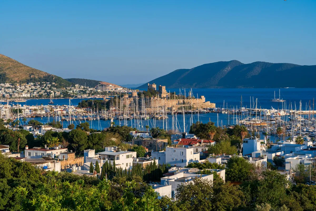A breathtaking view of Bodrum Castle overlooking the marina and cityscape in Türkiye.